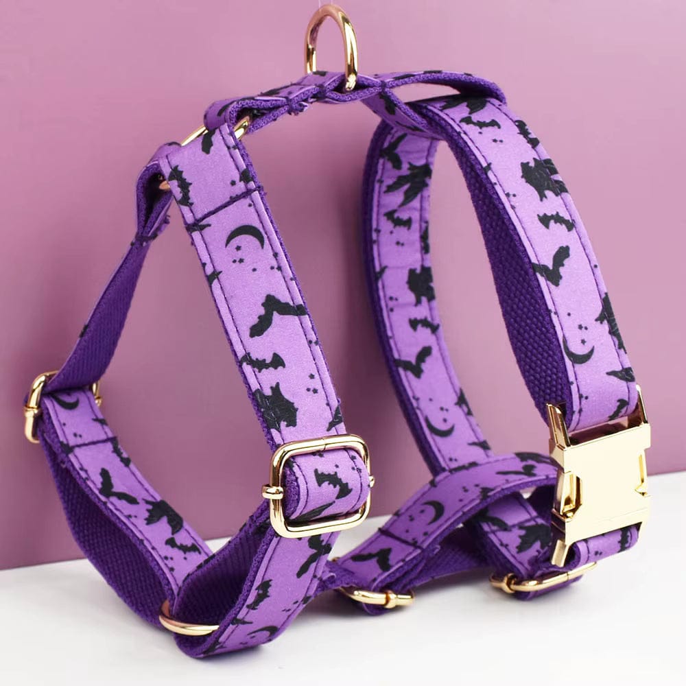 Purple dog harness with gold buckles and Halloween bat print straps