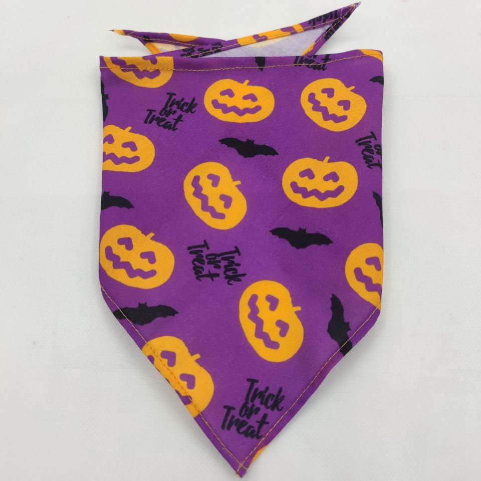 Pet triangle bandana scarf in purple with orange jack-o’-lanterns, bats, and “Trick or Treat”