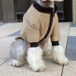 Khaki pet jacket hoodie close-up: zip front, dark collar, and ribbed sleeve cuffs.