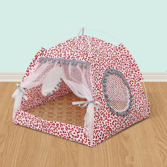 Red leopard-print pet tent bed with open mesh panels and round padded side entrances