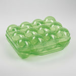 Plastic egg storage box with handle, clear green tray holding translucent green eggs