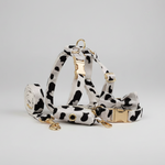Dog collar, harness, and leash set with cow-spotted fabric and gold hardware