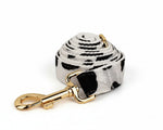Leash with clasp on rolled fabric strap; white with black spot pattern