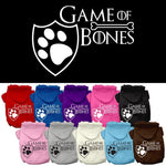 Assorted color pet hoodies with Game of Bones paw shield logo.