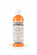 Apricot Kernel exfoliating & moisturizing pet shampoo bottle, orange with white cap and label.