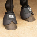 Gray horse bell boots on hooves with black straps and Jeffer's Equine logo patches.