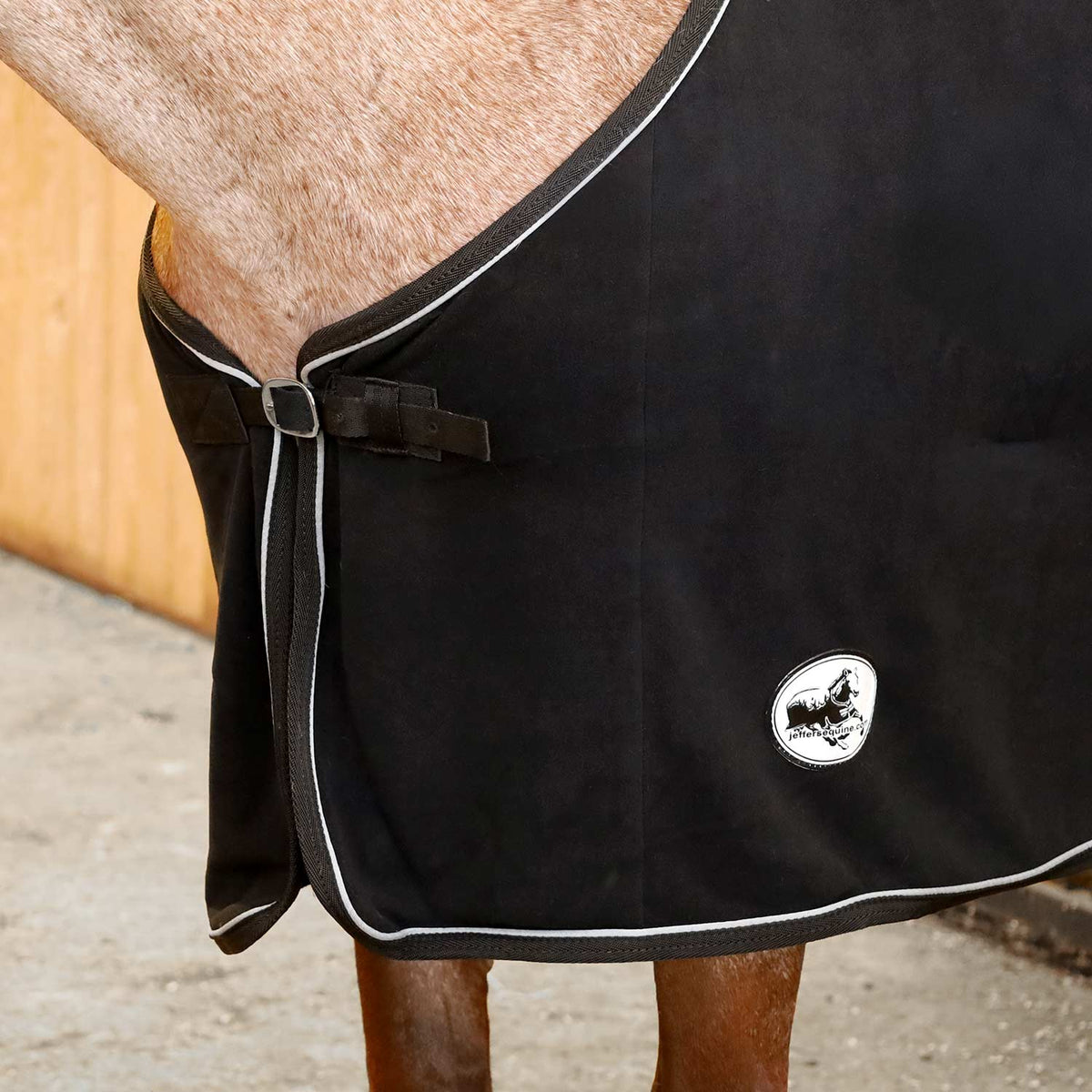 Horse fleece cooler blanket, black with buckled front strap and round logo patch