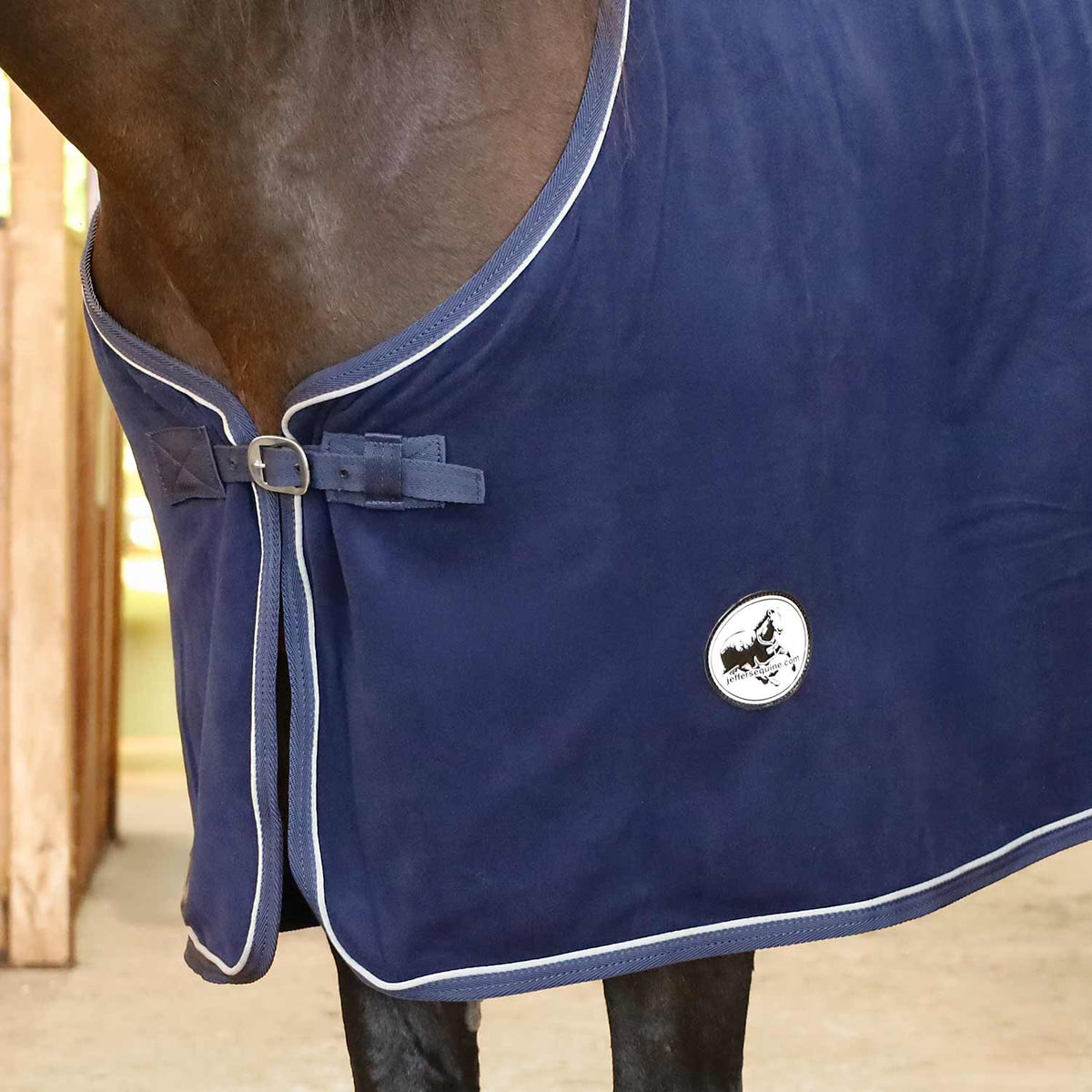 Horse fleece cooler blanket, navy with buckled front strap and round logo patch