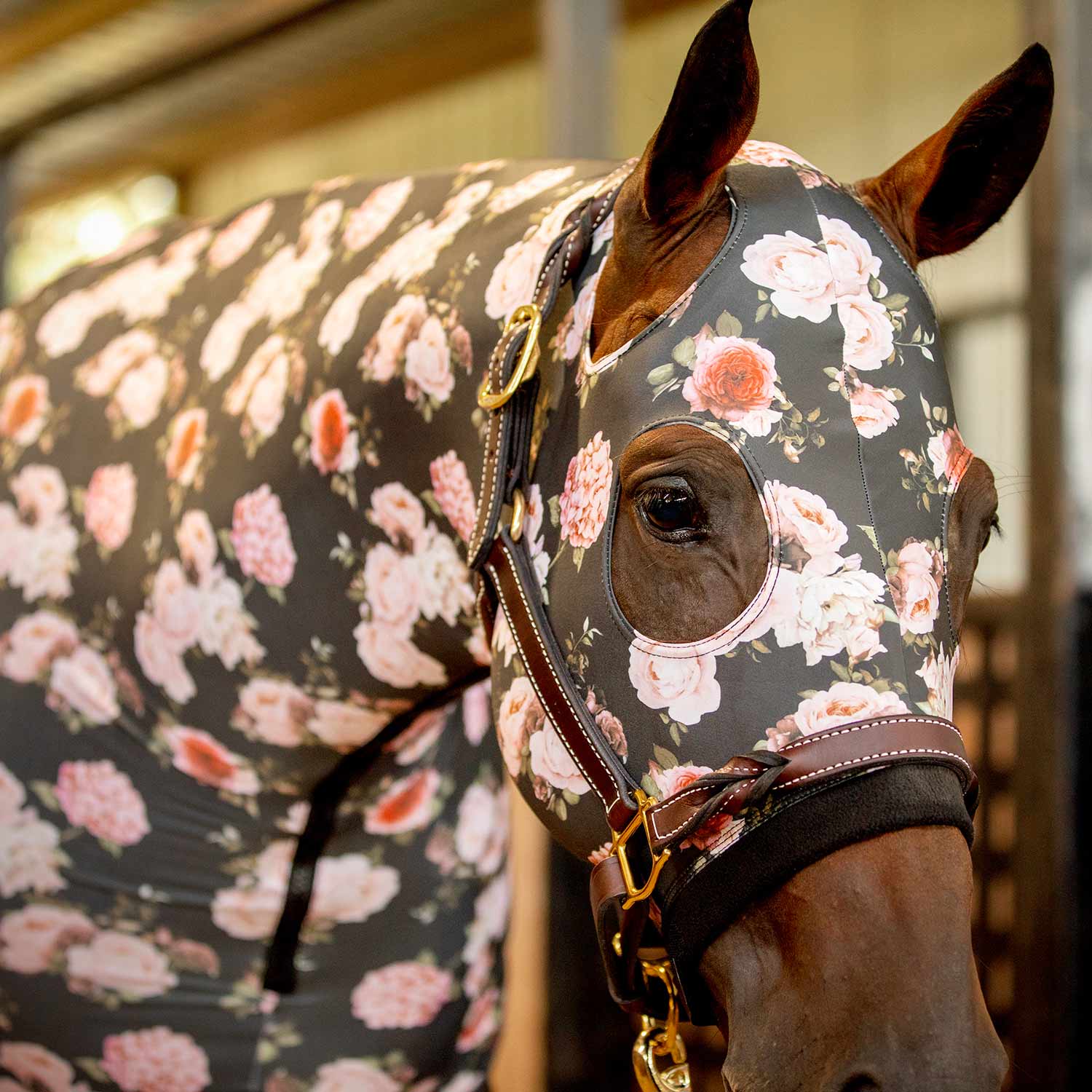 Floral lycra horse hood with ear openings and face opening, black base