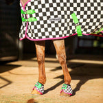Horse cooler fleece with black-and-white check print, neon green and pink trim