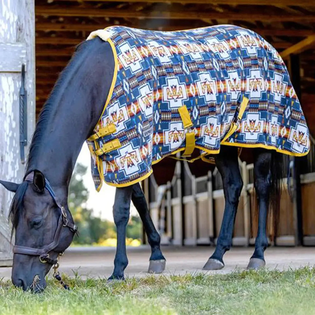 Horse cooler fleece with blue geometric collage print and yellow trim, back view