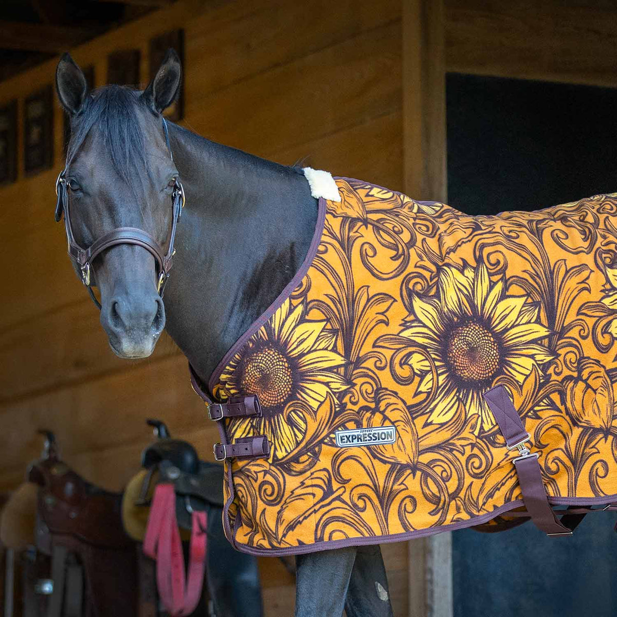Horse cooler fleece with orange-yellow sunflower and swirl pattern, front view