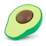 Close-up of avocado-shaped floating rubber dog chew toy with brown center, lime green