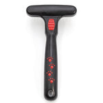 Pet undercoat grooming rake with spring metal pins and black T-handle with red accents