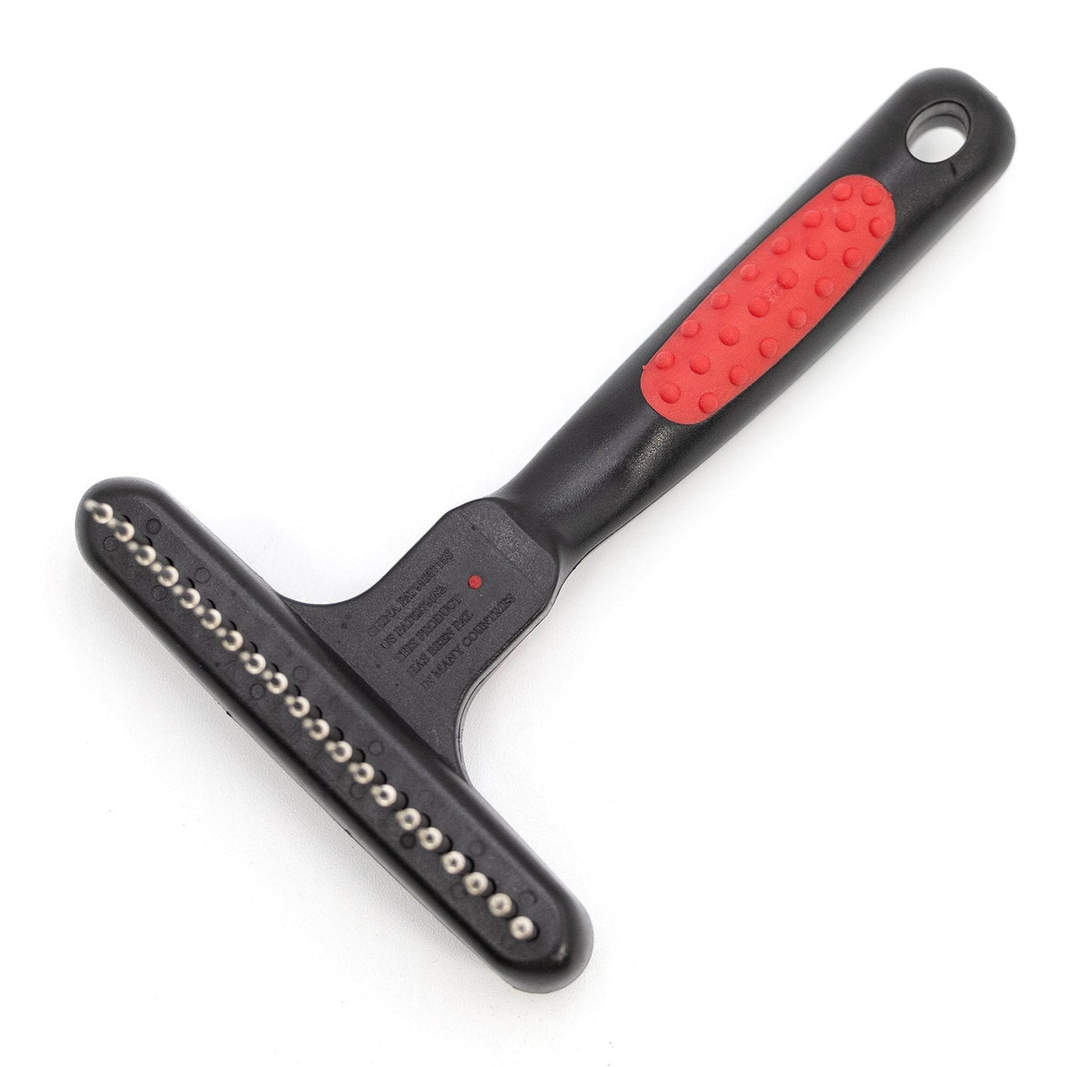 Pet undercoat grooming rake with spring metal pins and black handle with red textured grip
