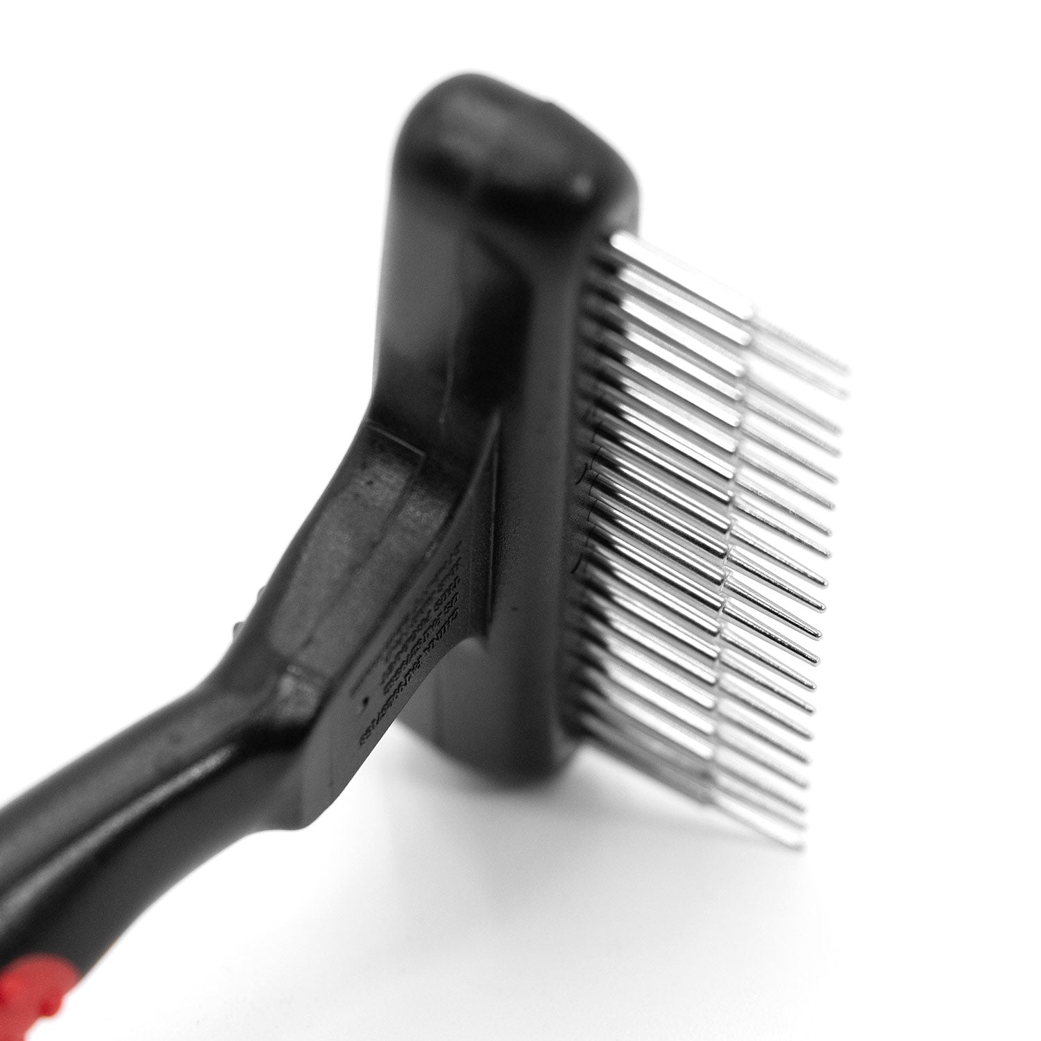 Pet undercoat grooming rake close-up with spring metal pins on black handle