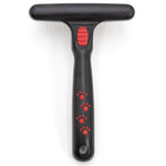 Pet undercoat grooming rake with spring pins and black handle with red paw icons