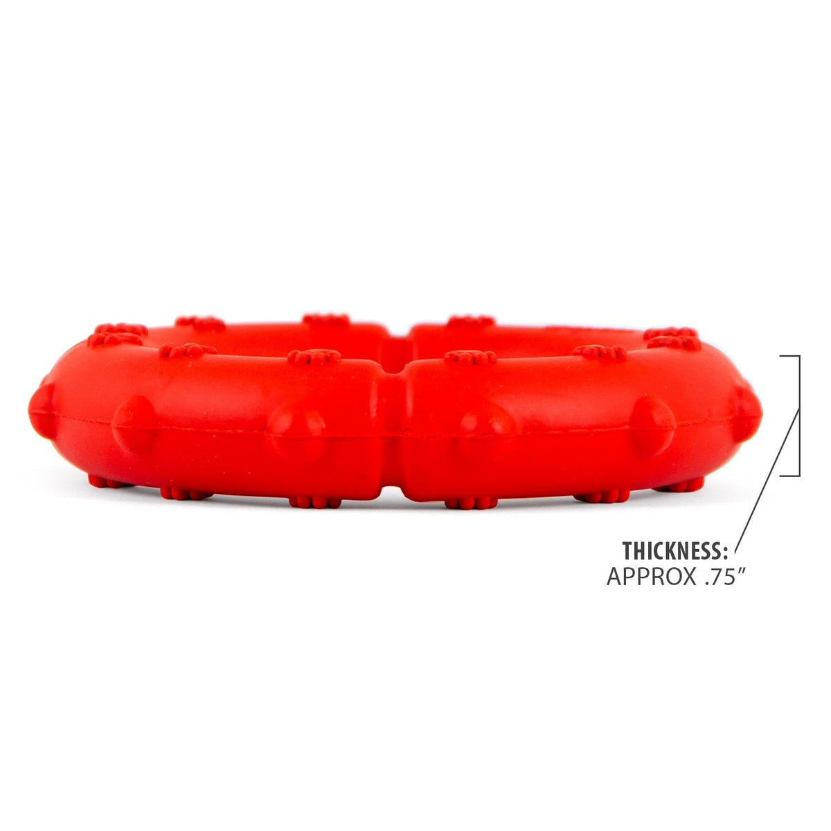 Red rubber dog tug ring chew, side profile with bumpy pawprint texture