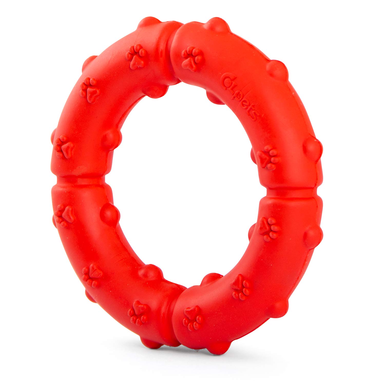Red rubber dog tug ring chew with pawprint texture, side view