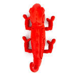 Red chameleon natural rubber dog chew toy, upright view with ribbed legs