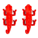 Red rubber chameleon-shaped dental dog chew toy with textured ridges and legs