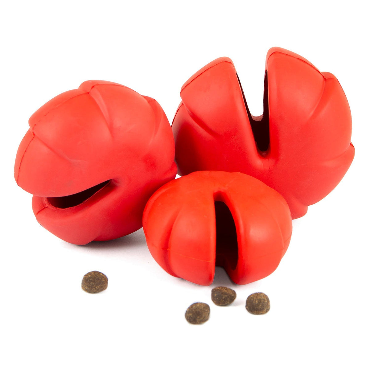 Red treat-dispensing dog chew toy with three-lobed shape and oval openings