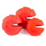 Red multi-lobed treat-dispensing dog chew toy with three side openings