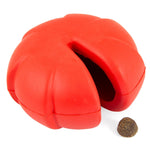 Red natural rubber dental dog chew toy with open cavity and a treat
