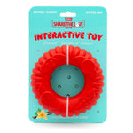 Red natural rubber interactive dog chew toy, flower-ring shape on package card