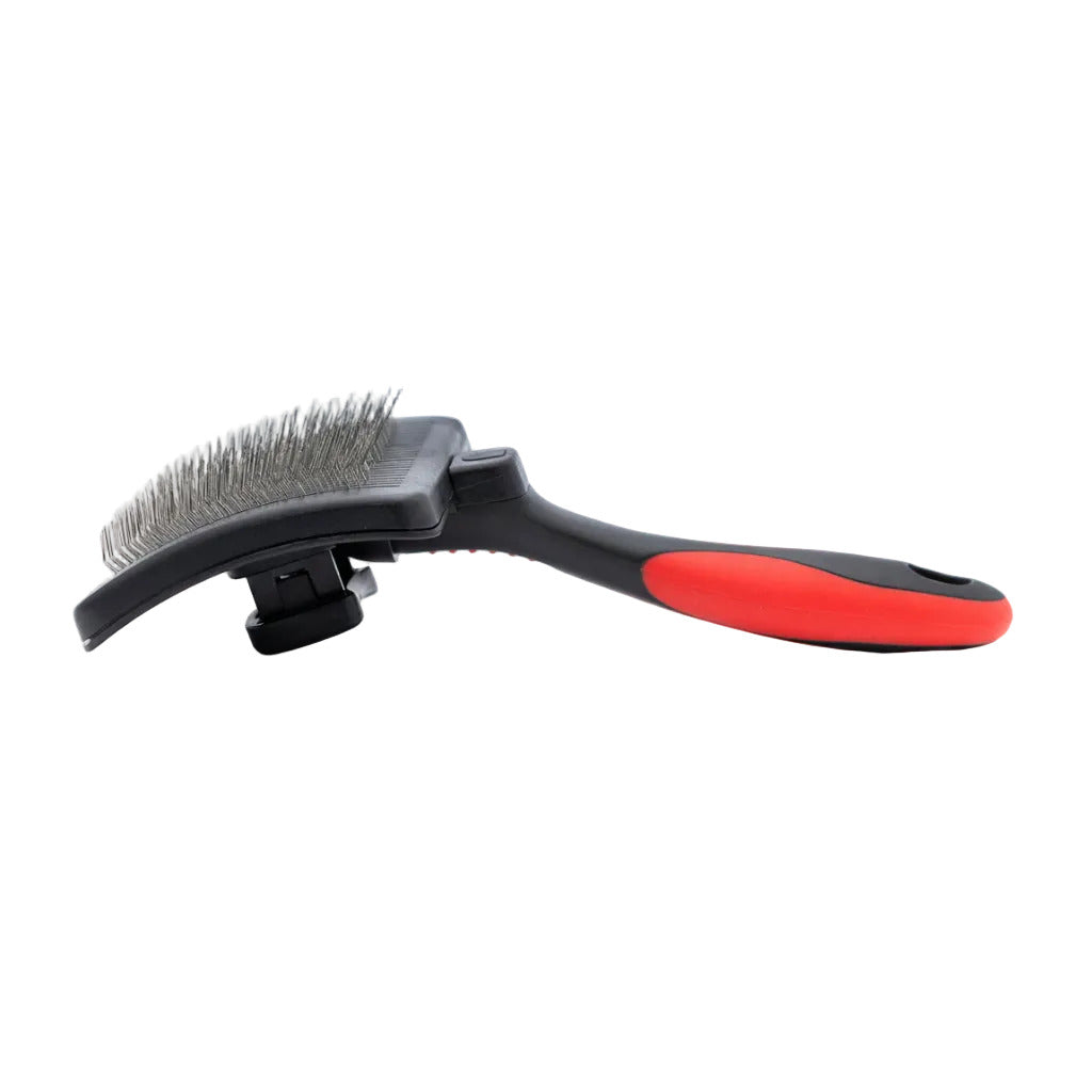 Slicker grooming brush with metal pin pad and red-and-black ergonomic handle