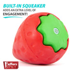 Strawberry-shaped natural rubber dog chew toy with red body and green inner panel