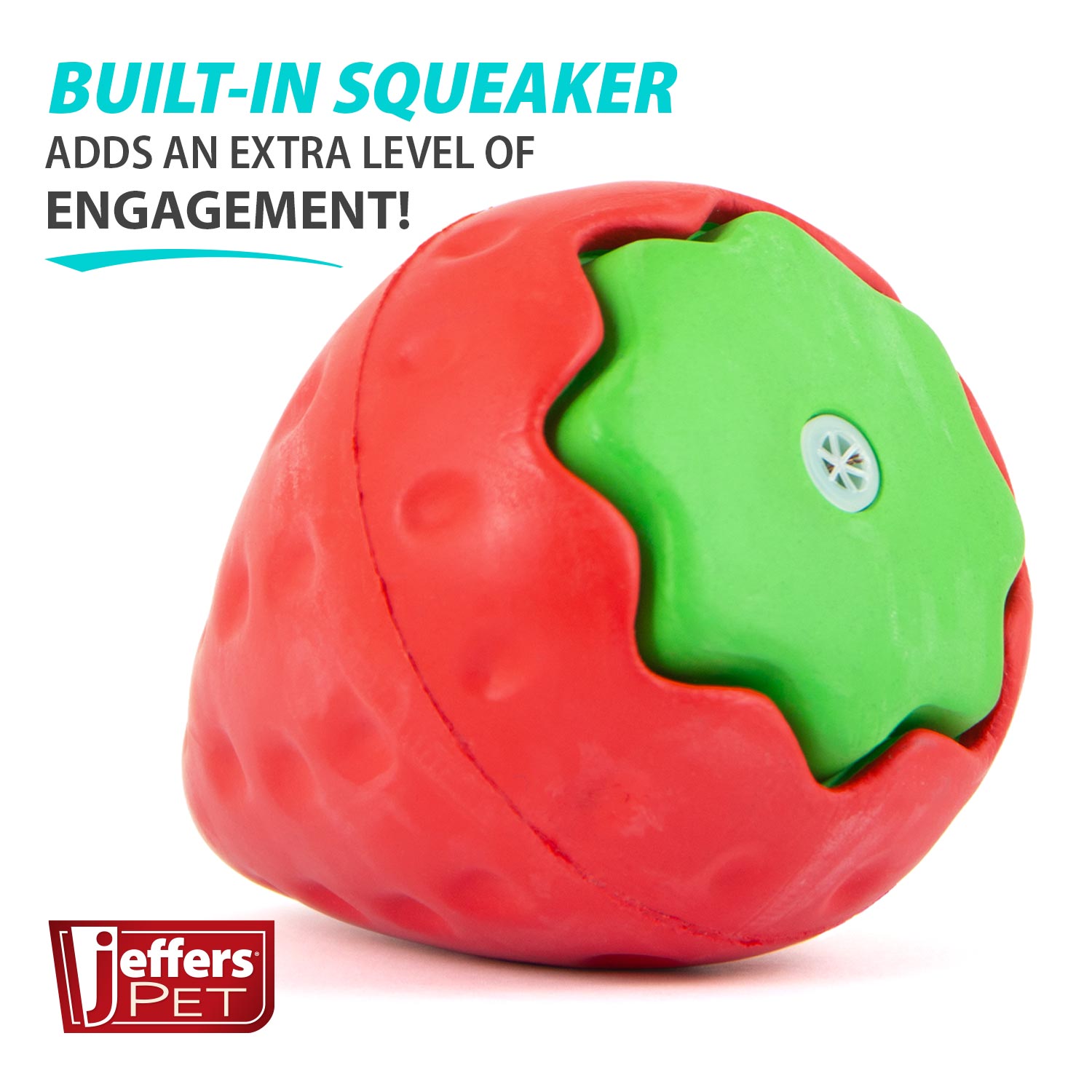 Strawberry-shaped natural rubber dog chew toy with red body and green inner panel