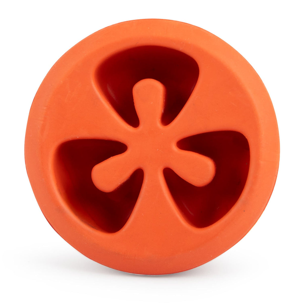 Red tomato-shaped natural rubber dog chew toy with star-shaped treat openings