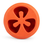 Red tomato-shaped natural rubber dog chew toy with star-shaped treat openings