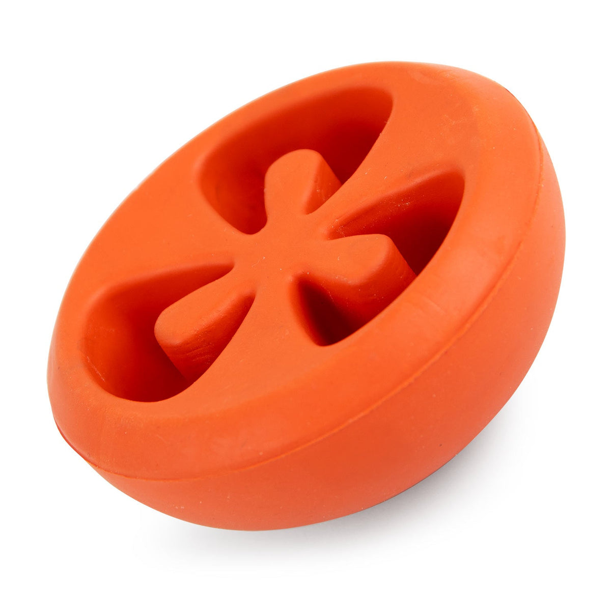 Red tomato-shaped treat-dispensing natural rubber dog chew toy, side view