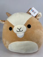 Large squishy plush animal, tan and cream face with closed-mouth smile and pointed ears