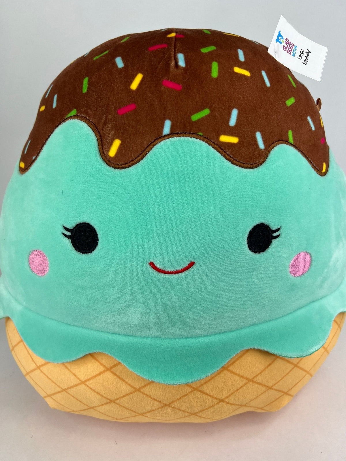 Large squishy ice cream plush, teal character with brown sprinkle topping and cone base