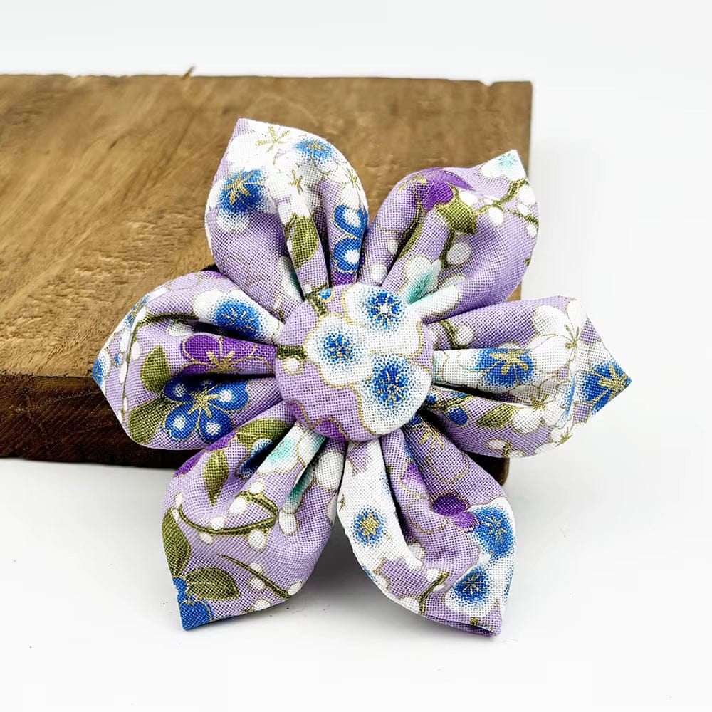 Lilac floral bow accessory with blue flower pattern and fabric petals