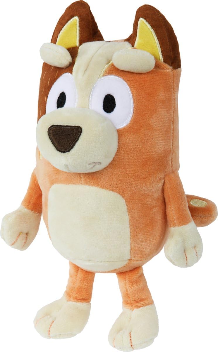 Orange and cream plush dog toy with big eyes and brown nose