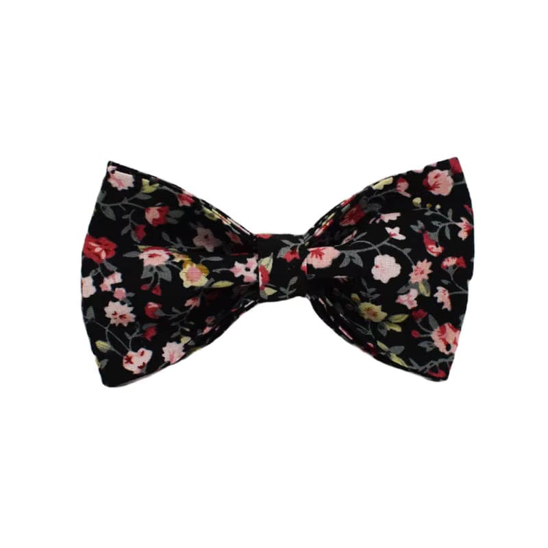 Floral pet bowtie accessory with black base and gold knot center