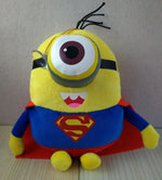 Yellow minion plush with gray goggles, blue shirt, red cape, and black gloves