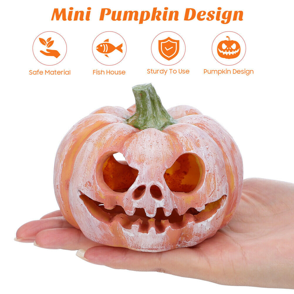Mini pumpkin resin fish hideout, carved face cutouts and green stem on hand