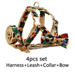 Floral pet harness with coordinating leash accessory, beige straps with multicolor leaf pattern