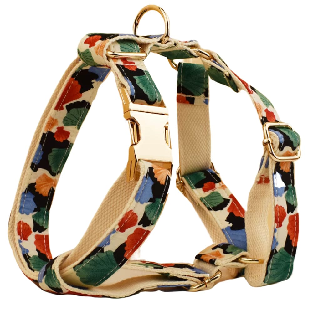 Floral pet harness with gold rings and straps, beige base with orange and green leaf pattern