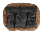 Brown plush dog bed with dark quilted cover panel and button details.