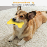 Dog chewing a yellow plush bone toy on a white fluffy carpet.