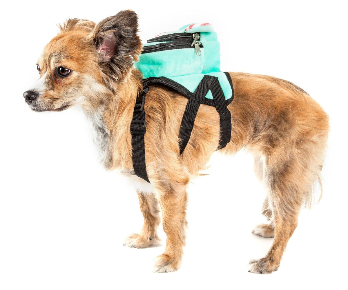 Dog wearing turquoise plush harness backpack with black straps and zip pocket on back