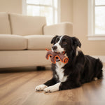 Brown plush animal dog toy with orange nylon squeaker accents, worn by a dog