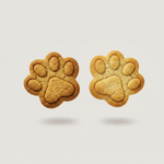 Paw-shaped pet treats: two dark golden-brown cookies side by side.