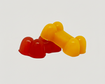 Assorted silicone pet treat pieces in red and yellow, bone-shaped treats.